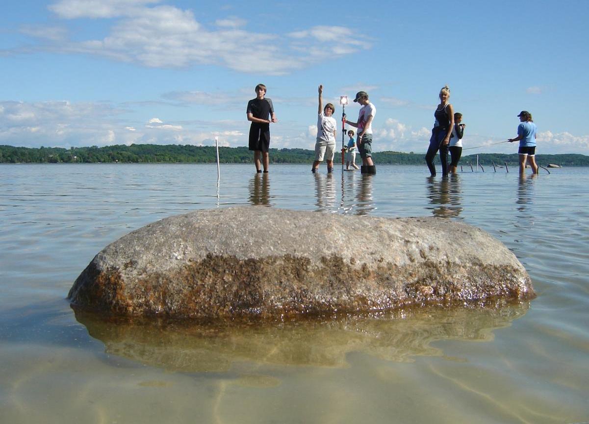 Surveying shipwreck remains in shallow water at Bower's Harbour
